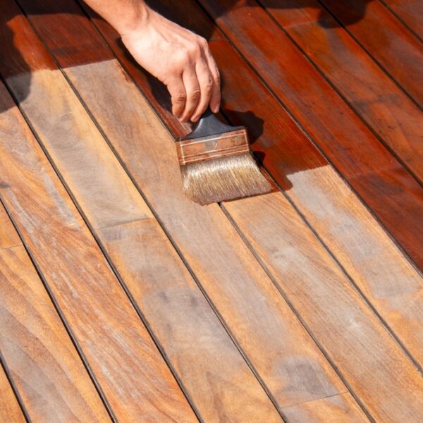 Woodworker,Refreshing,Wooden,Floor,,Worker's,Hand,Is,Applying,Decking,Oil