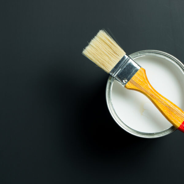 Paint,Brush,Placed,On,Top,Of,A,Can,Filled,With